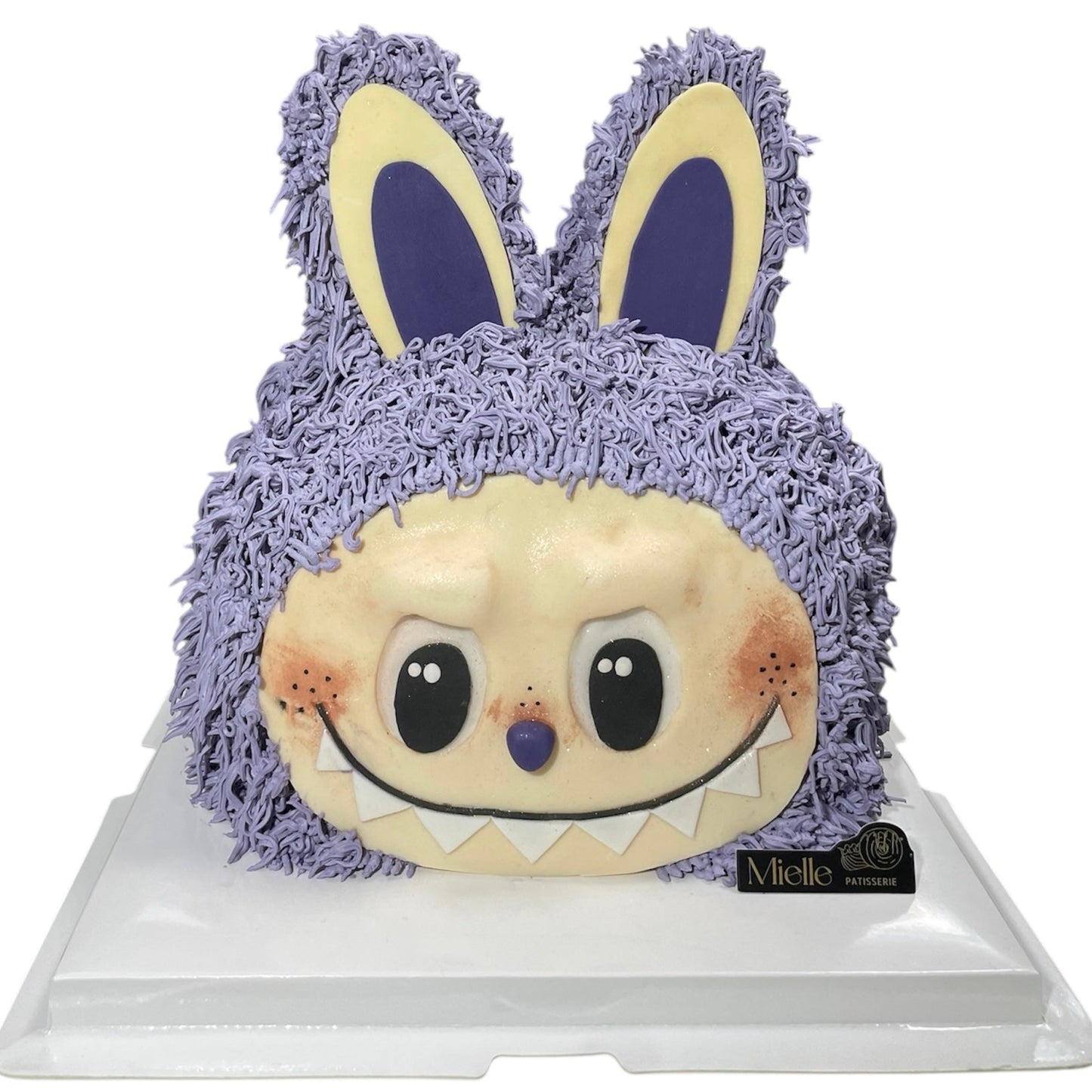 Plush cake with a purple bunny on a white background