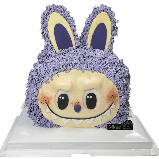 Plush cake with a purple bunny on a white background